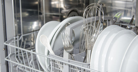 Dishwasher stacked with dishes and cutlery